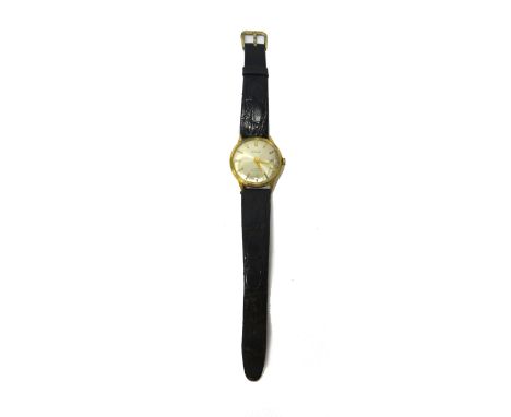 A gentleman's gold circular cased Desta Automatic wristwatch, the signed circular silvered dial, with gilt baton shaped numer