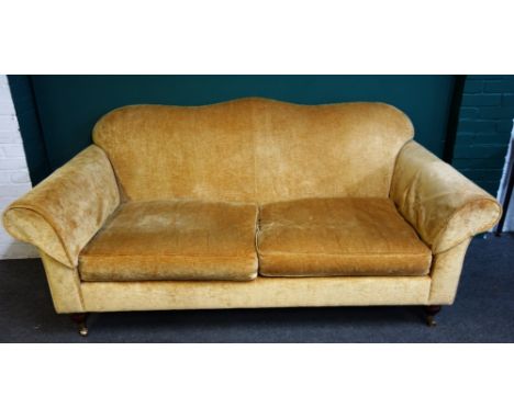 Wesley-Barrell; a 20th century gold upholstered humpback sofa, on turned supports, 203cm wide x 94cm high.