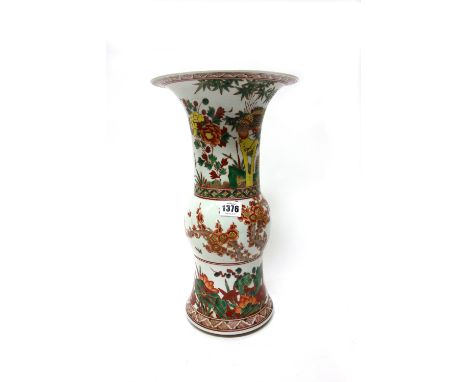 A Chinese beaker vase (gu), painted in a famille-verte palette with birds amongst flowering shrubs, branches of prunus blosso