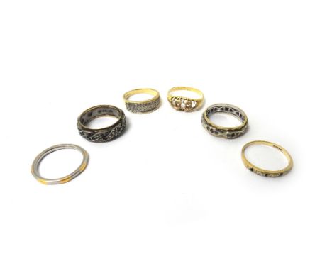 A 9ct gold and diamond set half hoop ring, mounted with three rows of circular cut diamonds, a gold and platinum, diamond set