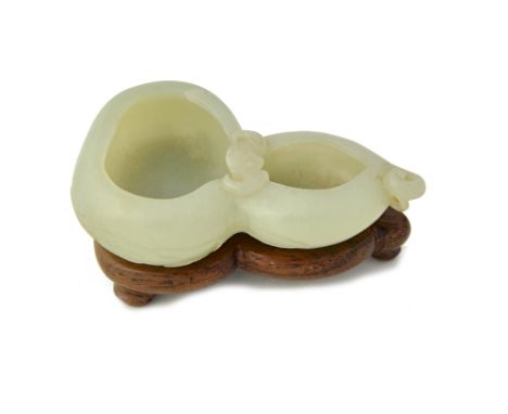 A small Chinese pale celadon jade `double gourd and bat' brushwasher, 19th century,  carved in the form of a double gourd sep