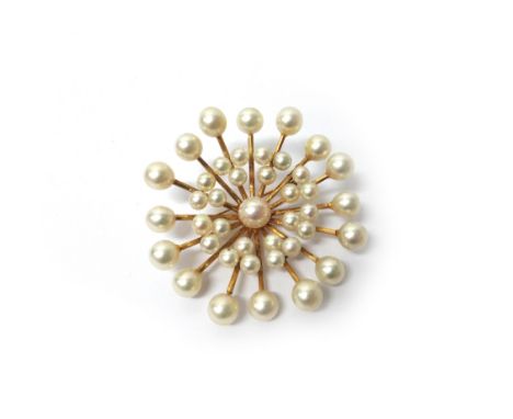 A gold and cultured pearl brooch, in a radiating circular design, mounted with the principal cultured pearl to the centre, de