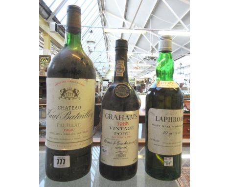 A magnum of Chateau Haut Batailly Paullac 1966, a Grahams 1985 vintage port, and a Laphroaig Islay malt Scotch whisky (3).