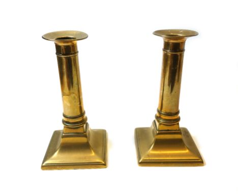 A quantity of collectables, comprising; a pair of Victorian brass candlesticks and later green tin shades, an alabaster figur