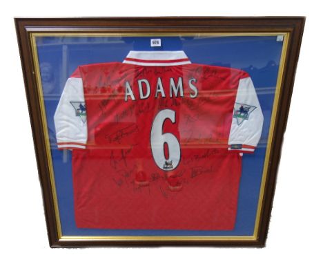 An Arsenal football shirt, 'Adams 6', signed by the players, framed and glazed, and another 2006/07 season signed Arsenal foo
