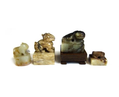 A small Chinese black and grey jade rectangular seal, Ming dynasty, 17th century, surmounted by a recumbent lion dog, zhuansh