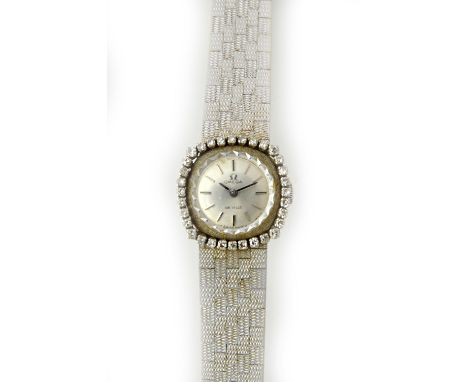 A lady's white gold and diamond set Omega De Ville dress bracelet wristwatch, the signed circular silvered dial with baton sh