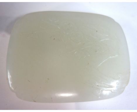 A Chinese white jade belt buckle, 19th/20th of rounded rectangular form, carved in low relief with branches of prunus blossom
