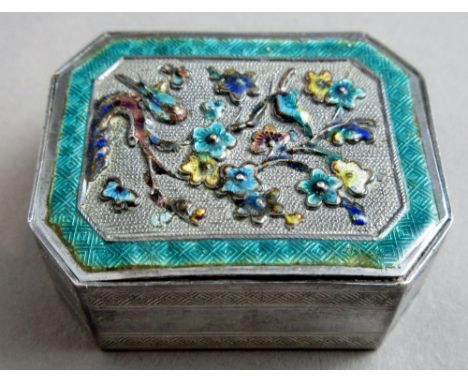 A 19th century Chinese or Japanese silver and enamelled trick opening pill box of cut cornered rectangular form, the lid fine