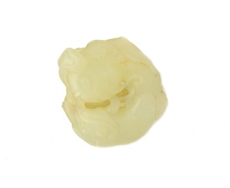 A Chinese pale celadon jade catfish pendant,  19th century, carved as two interlocked catfish with lingzhi sprigs, 5cm. wide,