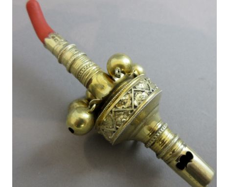 A George III silver-gilt baby's rattle and whistle, the circular knopped body applied with a row of six bells, with ring atta