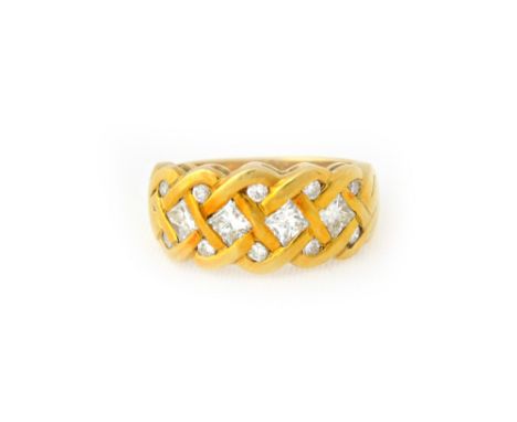 A gold and diamond ring, in an interwoven design, mounted with a row of four princess cut diamonds to the centre and otherwis