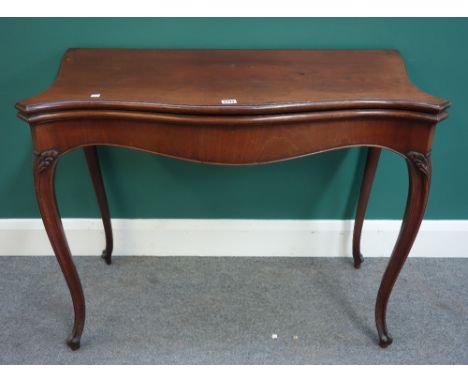 A George III mahogany serpentine card table on scroll supports, 96cm wide x 75cm high.  