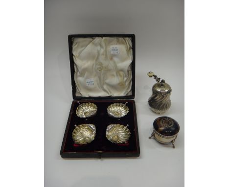 A set of four Victorian silver salts, each of scallop shell form, raised on three feet, Birmingham 1896, a matching set of fo