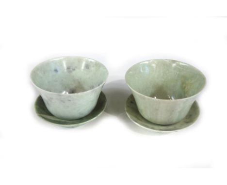 A pair of Chinese jade bowls and stands, 20th century, the sone of pale green tone with white and grey inclusions, bowls 9.5c