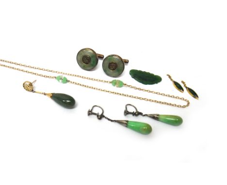 A pair of silver gilt mounted circular jade cufflinks, with Oriental character motifs, an oval link long chain, spaced with g