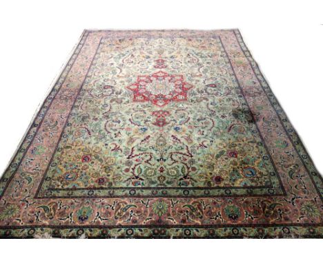 A part silk modern Chinese carpet, the sage field with a madder faceted medallion, matching beige spandrels, all with delicat