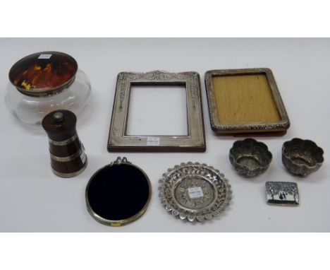 A silver and tortoiseshell lidded dressing table powder bowl, Birmingham 1925, three silver photograph frame mounts, a silver