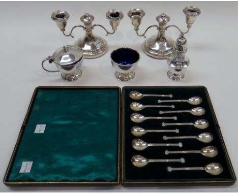 Two sets of six matching coffee spoons, the handles formed as classical columns, Sheffield 1924 and 1926, cased, a three piec
