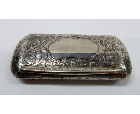 A Victorian silver snuff box of rounded rectangular form, with all over engraved scroll decoration, the flush hinged lid cent