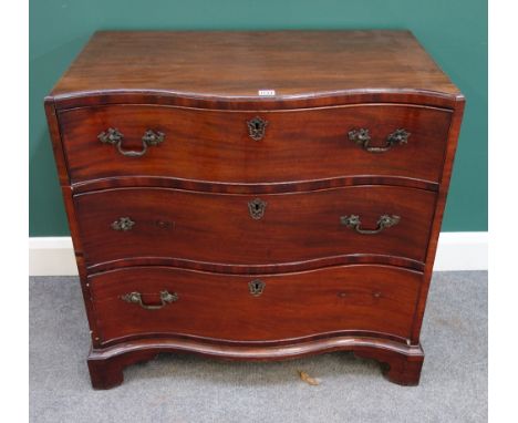 A George III mahogany serpentine chest of three long graduated drawers, on bracket feet, 84cm wide x 82cm high. 