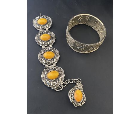 A vintage white metal bracelet with yellow stones and a hallmarked filigree bangle.