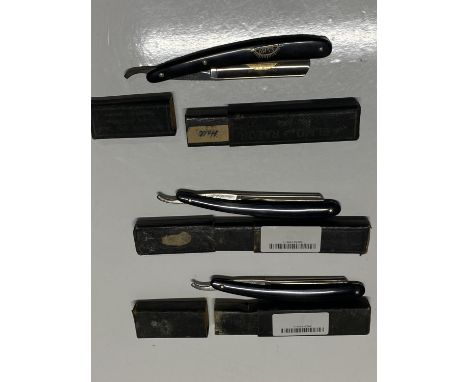 Three vintage cut throat razors