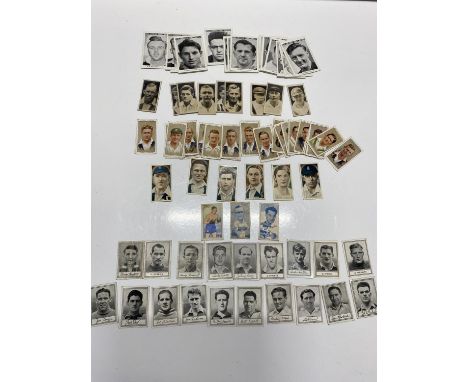 A selection of vintage and antique sporting cigarette cards including football, cricket including a selection of 1954 Barratt