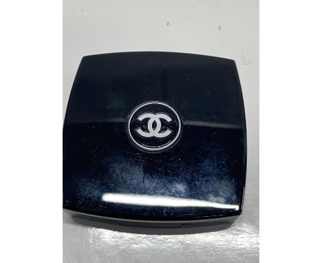 A Chanel powder compact