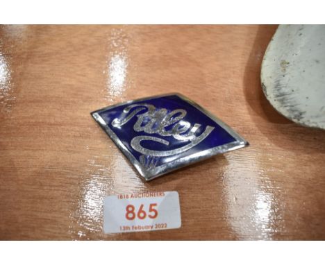 A motor car enamel badge for Riley