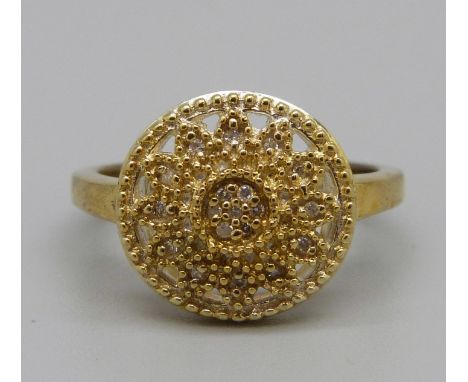 A silver gilt, nineteen stone diamond cluster ring, Q 