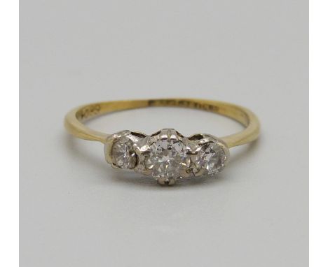 An 18ct gold, platinum set three stone diamond ring, 1.5g, L, one stone a/f, shank worn 