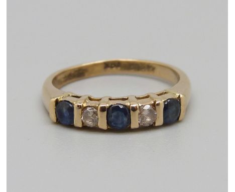 A five stone sapphire and diamond ring, marked 18ct, 4.1g, N 