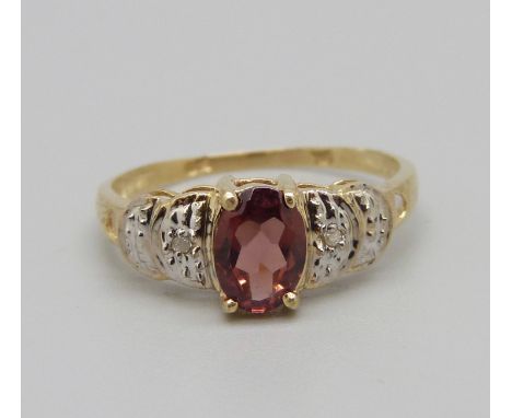 A 9ct gold ring, set with garnet and small diamonds, 1.4g, O 