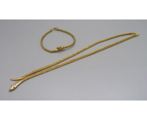A yellow metal snake necklace with ruby eyes and a matching bracelet, marked 333, 18.5g 