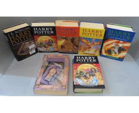 Five Harry Potter first edition hard back books including two Half Blood Prince and Deathly Hallows, an Exploring Harry Potte