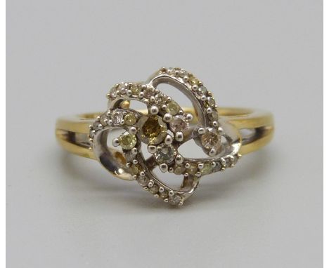 A yellow metal and diamond ring, single cognac coloured and 34 white diamond, 2.7g, M 