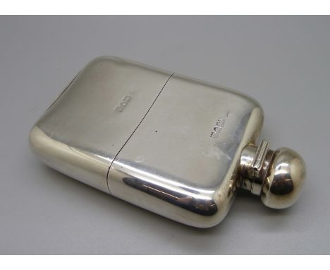 A silver hip flask, marked Stuart Dawson Ltd., Regent Street W., 205g 