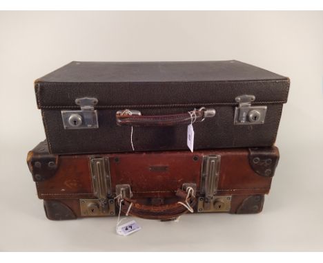 A vintage 'Paxhall' leather suitcase plus a vintage fitted dressing case with two bottles, brush and comb