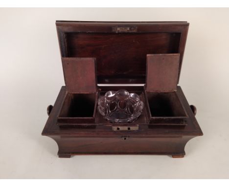 A mid Victorian rosewood tea caddy with fitted canisters to interior
