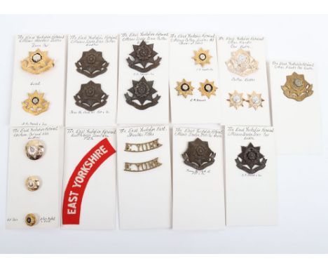 Selection of Badges, shoulder titles & buttons to The East Yorkshire Regiment. Lot includes examples of the Officer’s Service