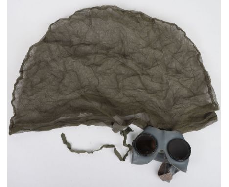WW2 German Army Sun Protection Goggles: Field grey leather with tinted glass lenses with strap to back and mosquito net. 2 it