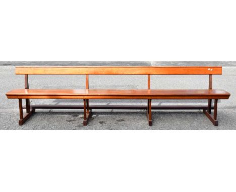 A late 19th/early 20th century mahogany church pew, to square supports, with tilting knee rest to the back, 77 x 305 x 64cm.