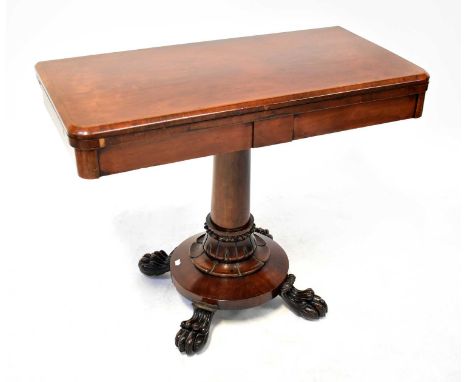 A Victorian rosewood fold-over card table, with circular green baize lined surface, turned column to circular base with four 