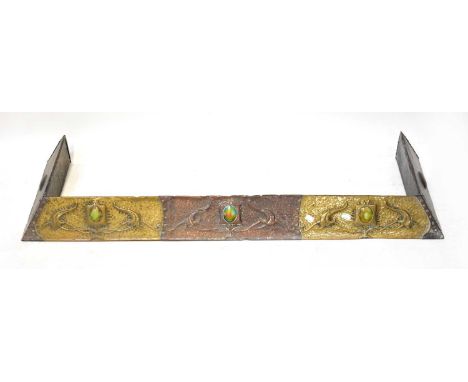 An Art Nouveau brass and copper fender, with Ruskin-style ceramic roundels to the centre of each section of floral embellishm