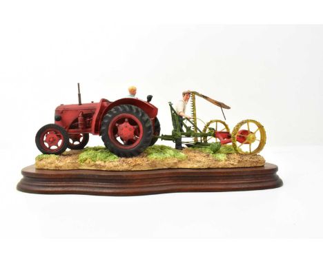 BORDER FINE ARTS; a tractor figure group, 'The Fergie', a red tractor pulling a plough, on wooden plinth, length 33cm, in car