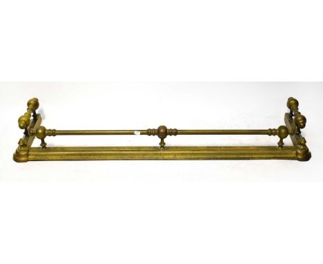 A brass fire fender, together with a pair of fire dogs and various fire irons, comprising tongs, shovel, and pokers.Condition