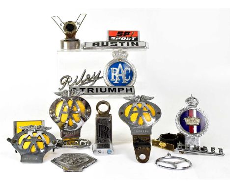 A collection of car badges, to include Daimler, Riley, Austin, Mercedes, Humber, Triumph and Rolls-Royce, also AA and RAC bad