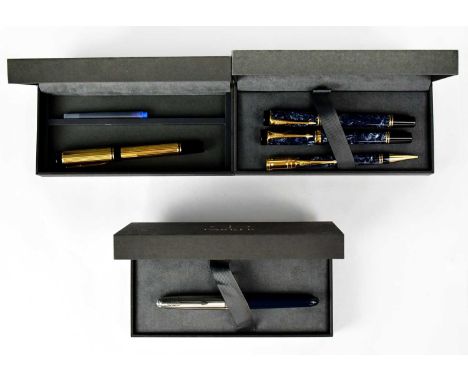 PARKER; a boxed fountain pen with 18ct gold nib, a further three-pen set, each with blue marbled resin bodies, comprising fou