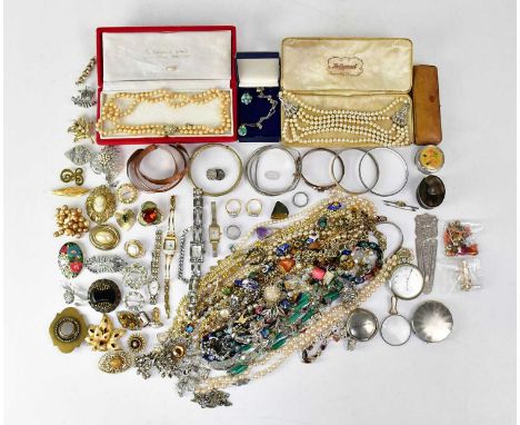 A large quantity of vintage costume jewellery, to include faux pearls, beaded necklaces, chains, metal bangles, bracelets, a 